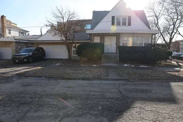 a view of a house with a snow in the yard