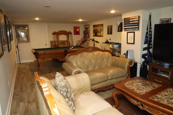 a living room with furniture and a flat screen tv