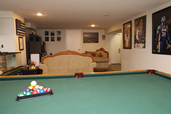 a living room with a couch and a stove top oven