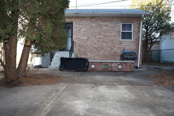 a view of a backyard of the house