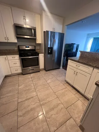 a room with furniture and a flat screen tv
