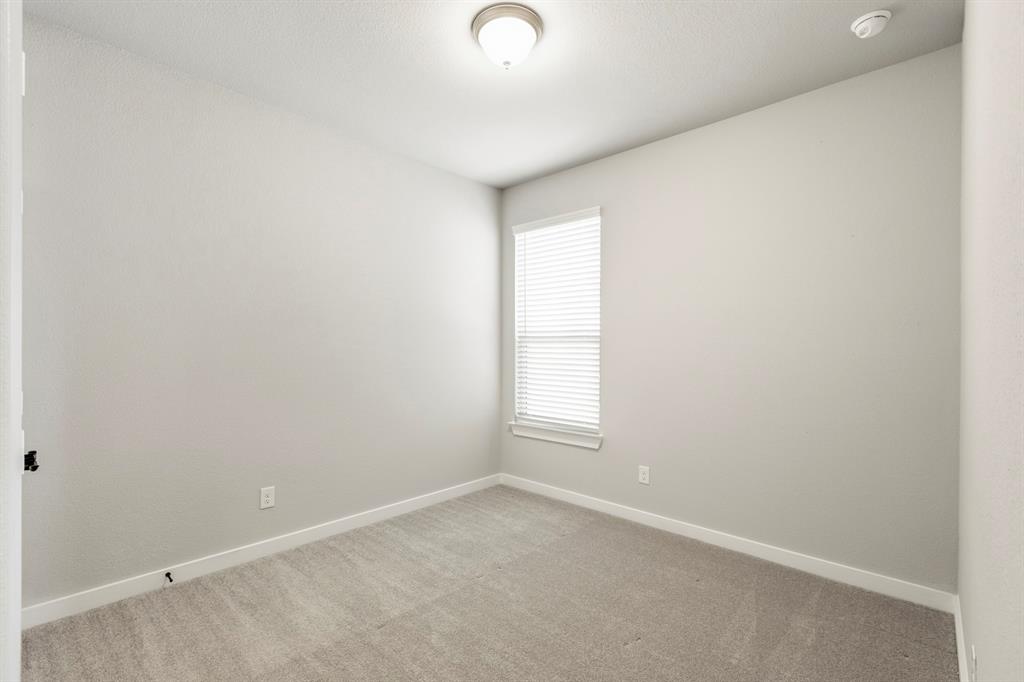 3311 Willena Road Melissa, TX 75454 - Photo 35 of 40 Carpeted room with a single window featuring blinds, a ceiling-mounted light fixture, and light-toned walls