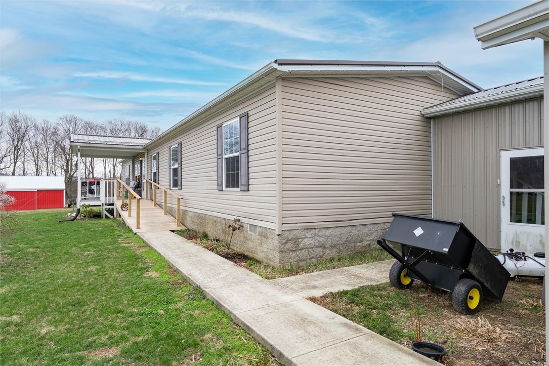 1926 Fairview Road Peebles, OH 45660 - Photo 5 of 44 This charming home features a convenient ramp entry and a detached shed in the background.