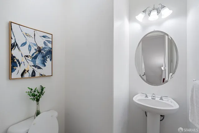a bathroom with a sink and mirror