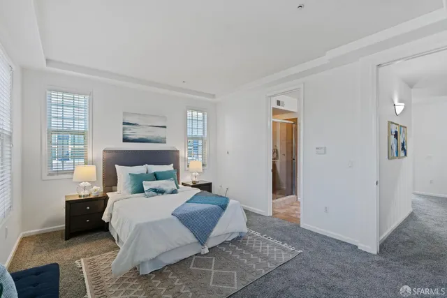 a bedroom with a bed and a couch