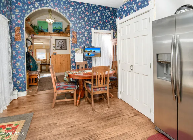 a view of a dining room with furniture window and wooden floor