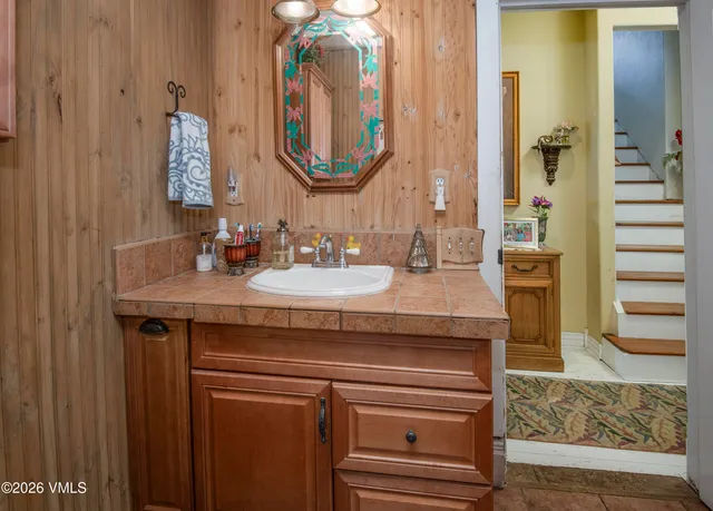 a bathroom with a sink and a mirror