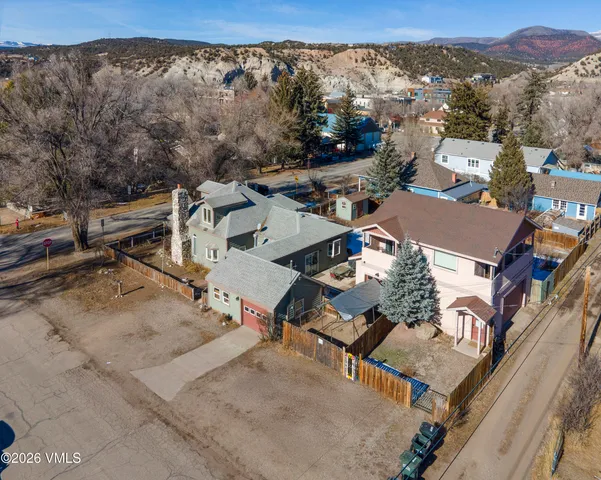 an aerial view of a residential apartment building with a yard