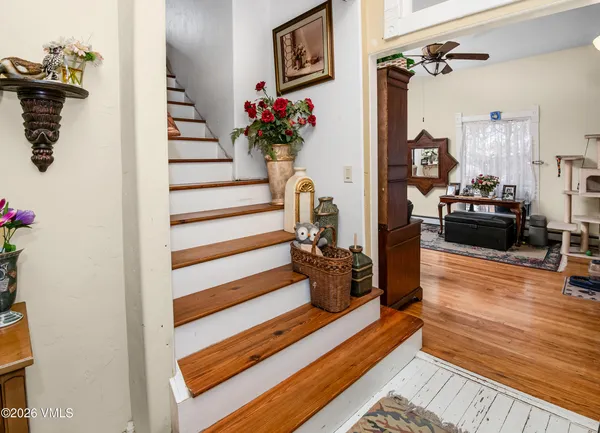 a view of living room with furniture and wooden floor