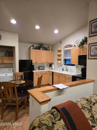 a view of kitchen with breakfast area