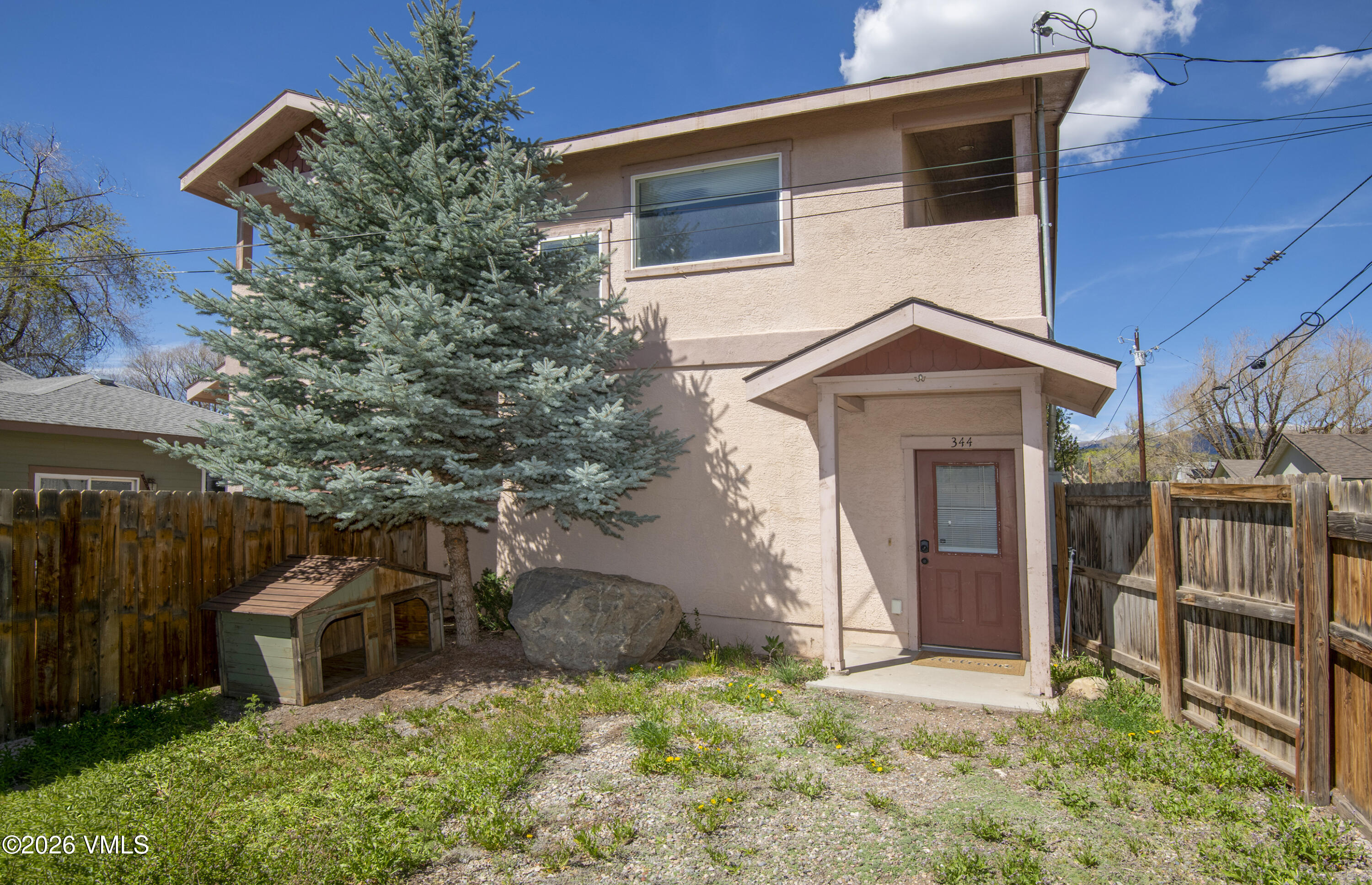 344 Capitol Street Eagle, CO 81631 - Photo 49 of 63 a front view of a house with a yard