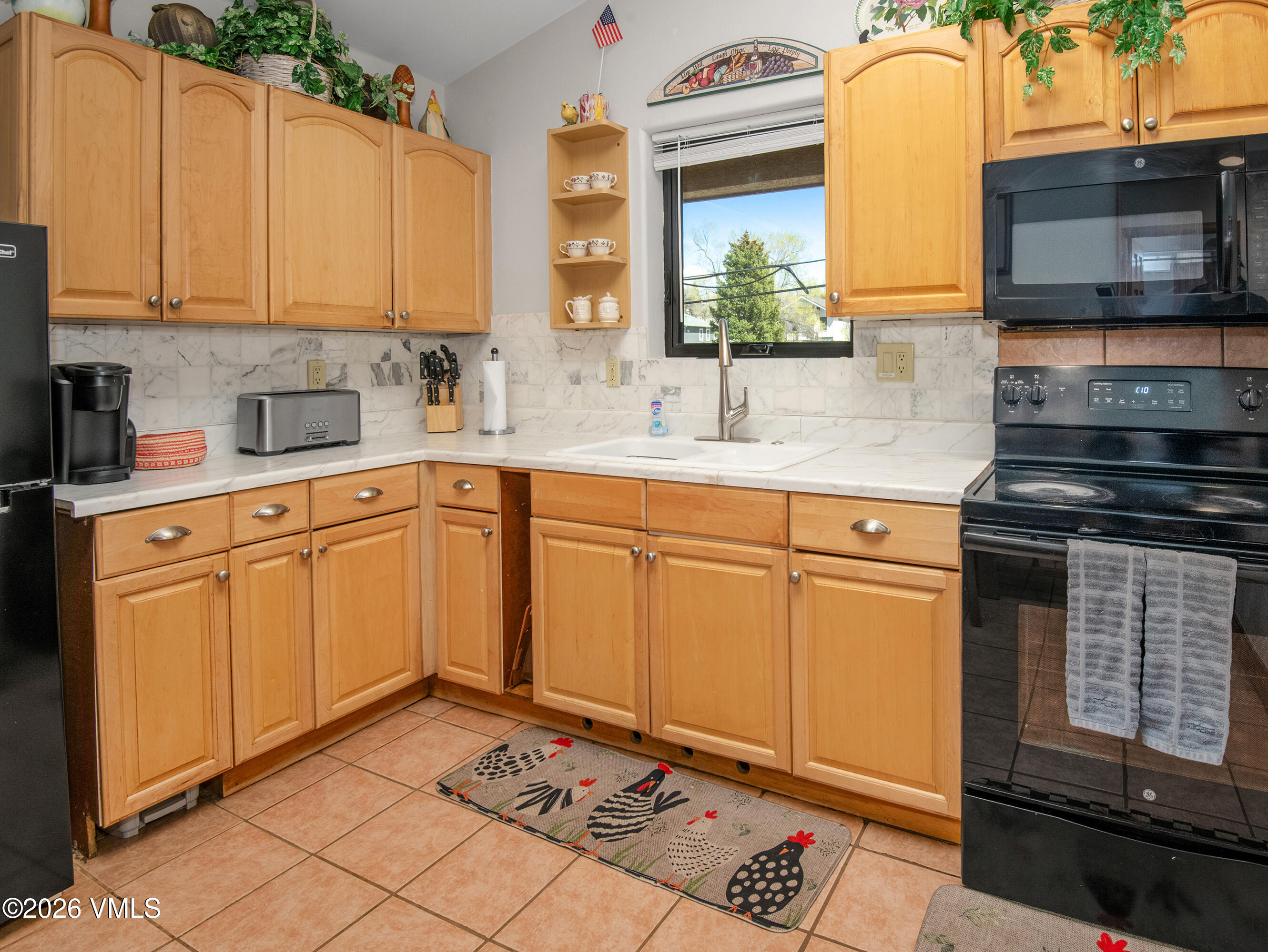 344 Capitol Street Eagle, CO 81631 - Photo 56 of 63 a kitchen with sink cabinets and appliances