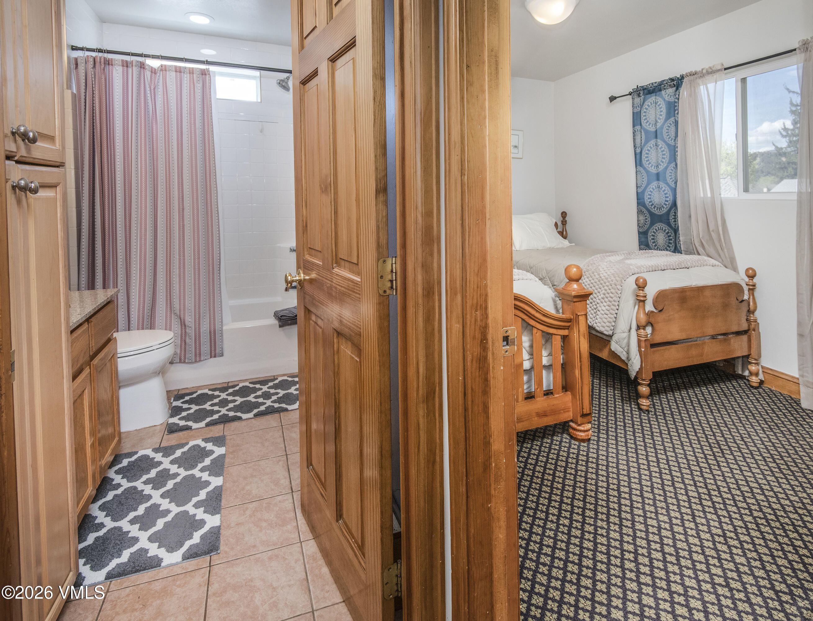 344 Capitol Street Eagle, CO 81631 - Photo 58 of 63 a bedroom with furniture and a window