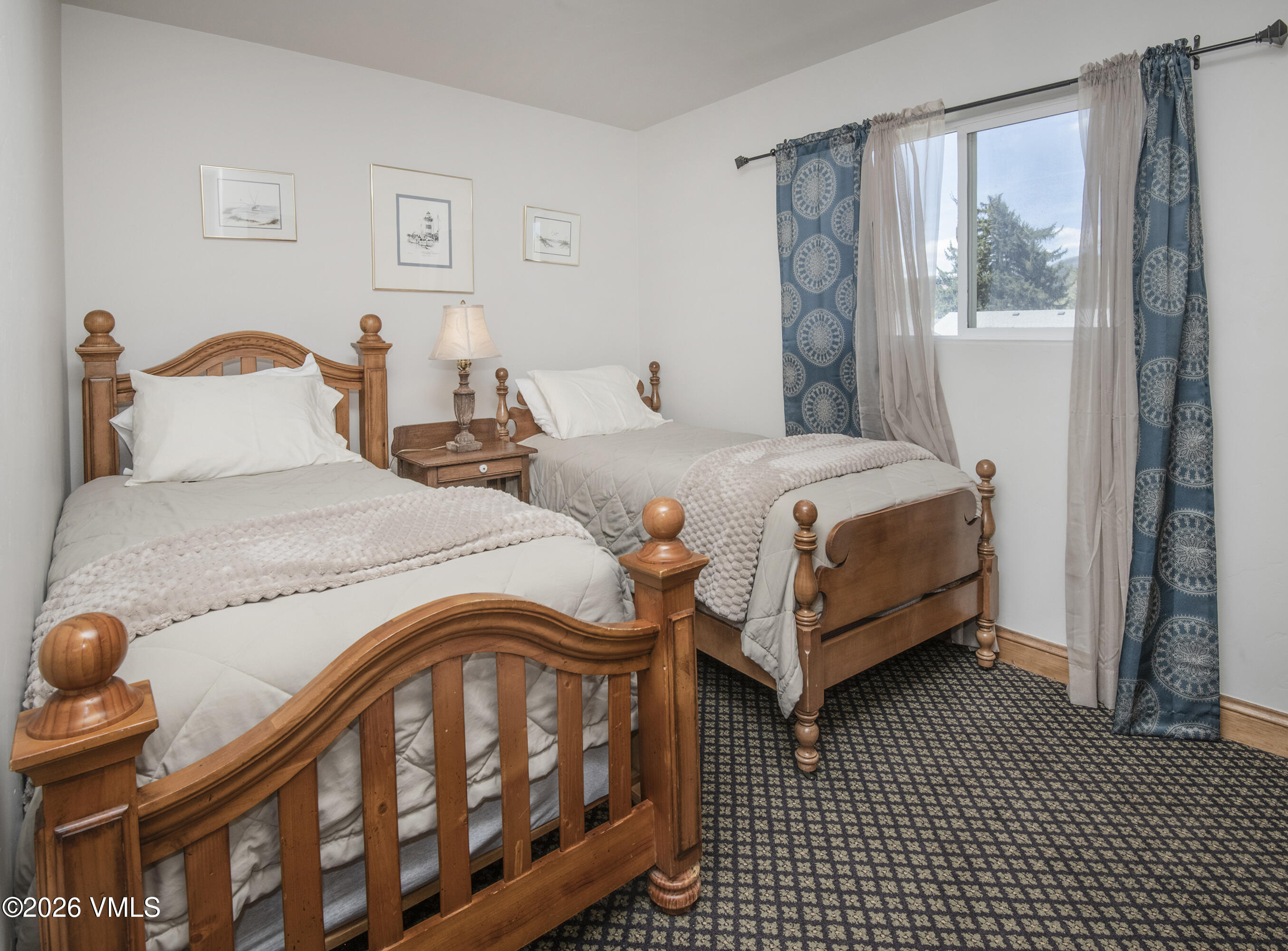 344 Capitol Street Eagle, CO 81631 - Photo 59 of 63 a bedroom with a bed and wooden floor