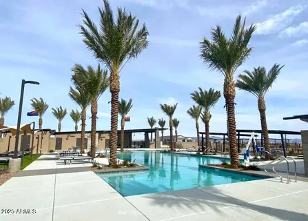 a view of a swimming pool with a table and chairs
