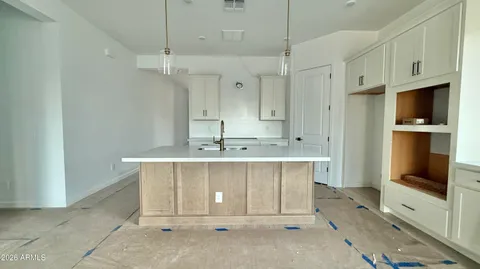 a bathroom with a sink a mirror and shower