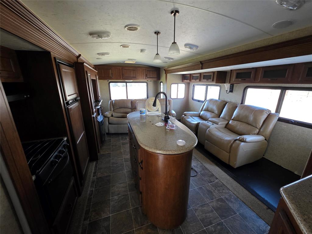 1000 County Road 375 Rising Star, TX 76471 - Photo 6 of 40 a living room with furniture and a flat screen tv