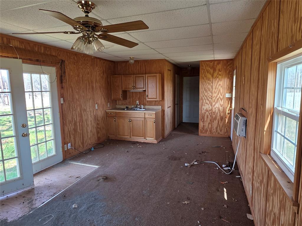 1000 County Road 375 Rising Star, TX 76471 - Photo 8 of 40 a view of a kitchen with a stove cabinets and a kitchen