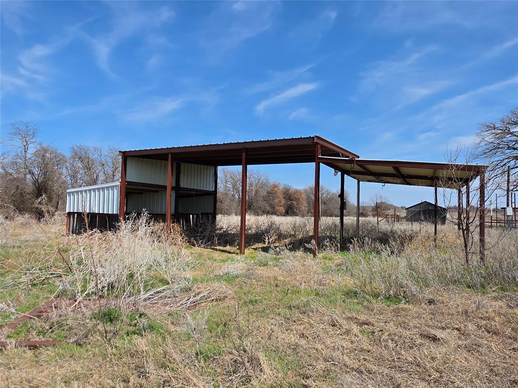 1000 County Road 375 Rising Star, TX 76471 - Photo 10 of 40 a backyard of a house with table and chairs