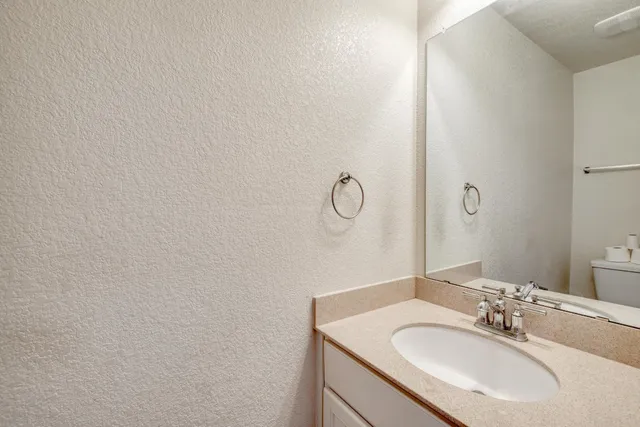 a view of kitchen with cabinets and wooden floor