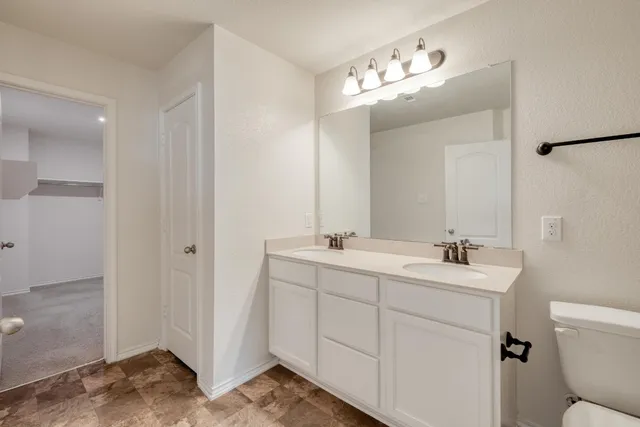 a view of a livingroom with a ceiling fan and window