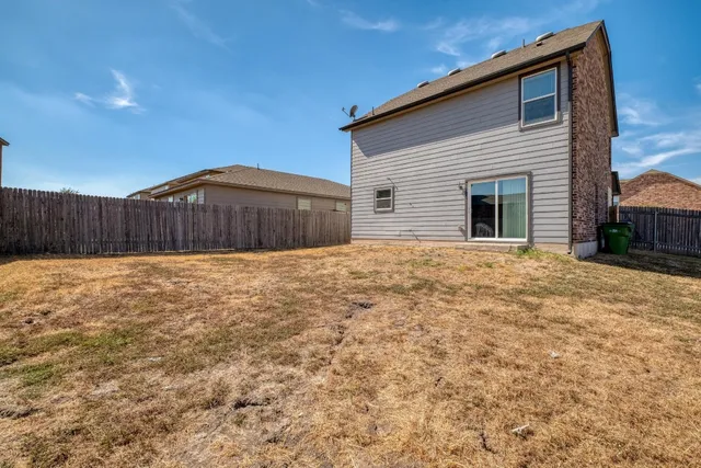 a view of backyard of house