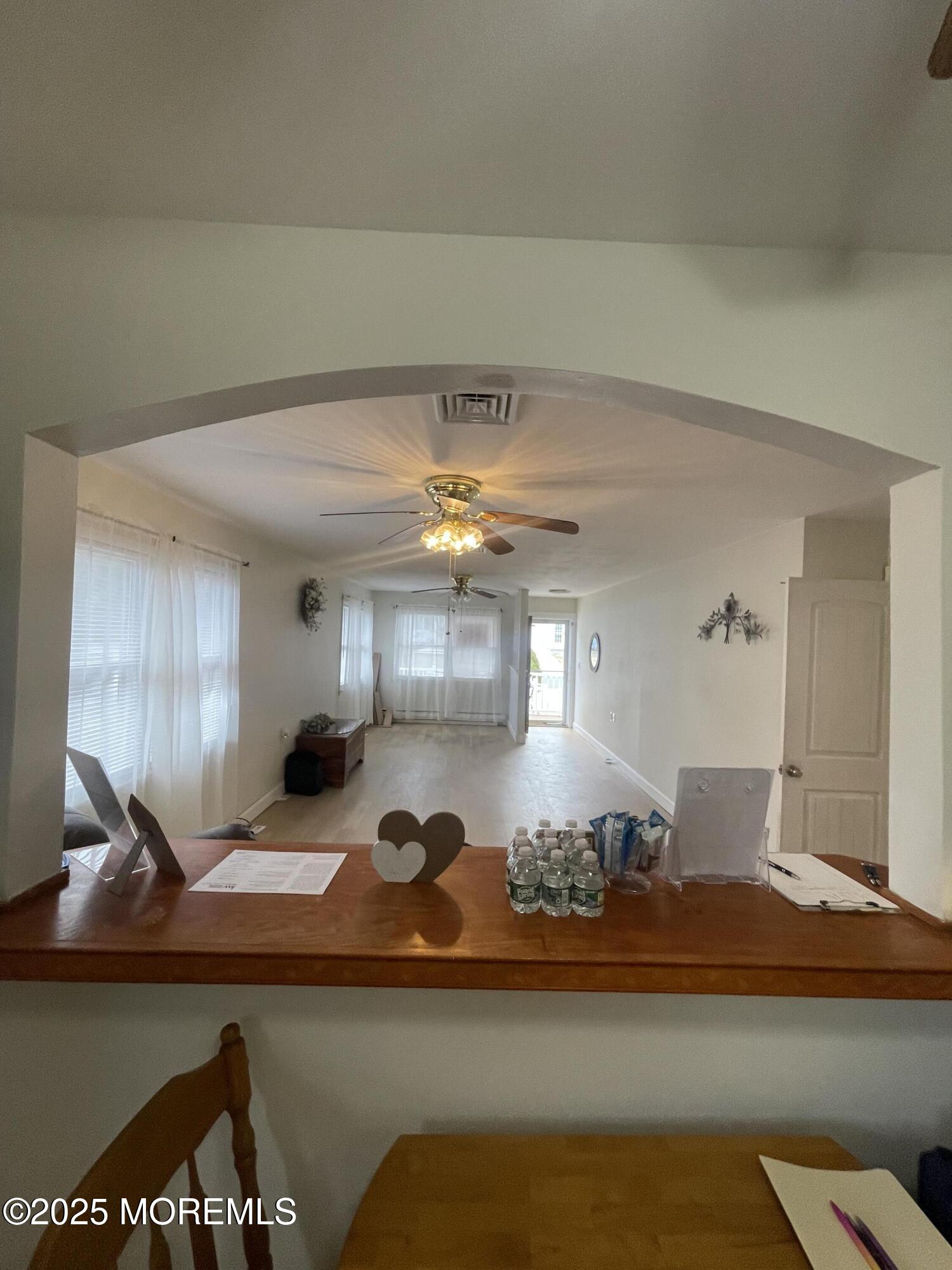 35 Sycamore Access Road, Unit 12 Manahawkin, NJ 08050 - Photo 16 of 34 a view of living room with furniture and chandelier