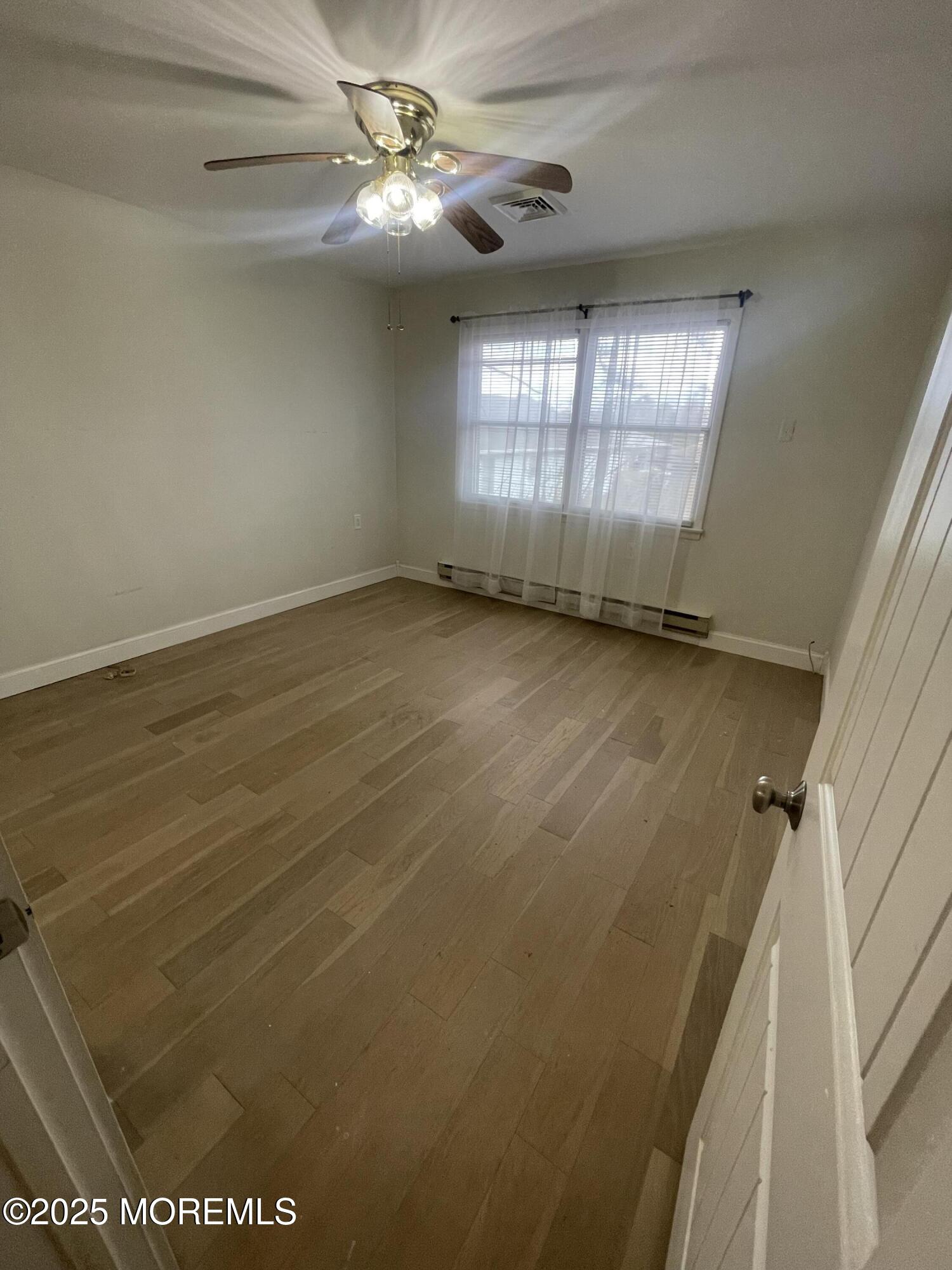 35 Sycamore Access Road, Unit 12 Manahawkin, NJ 08050 - Photo 24 of 34 a view of an empty room with a window