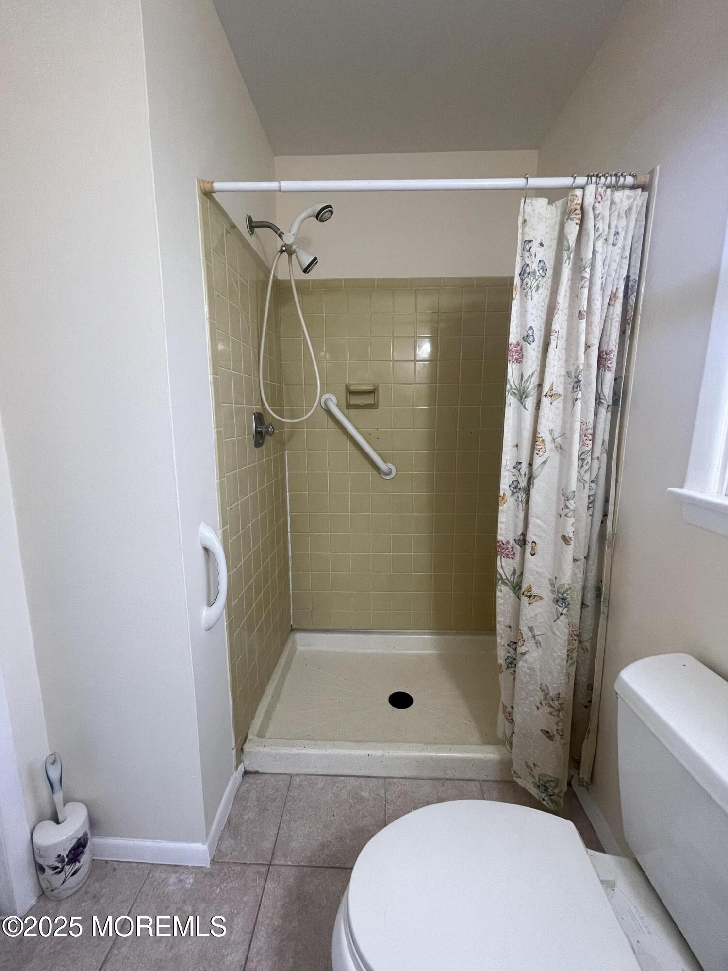 35 Sycamore Access Road, Unit 12 Manahawkin, NJ 08050 - Photo 29 of 34 a bathroom with a toilet and shower