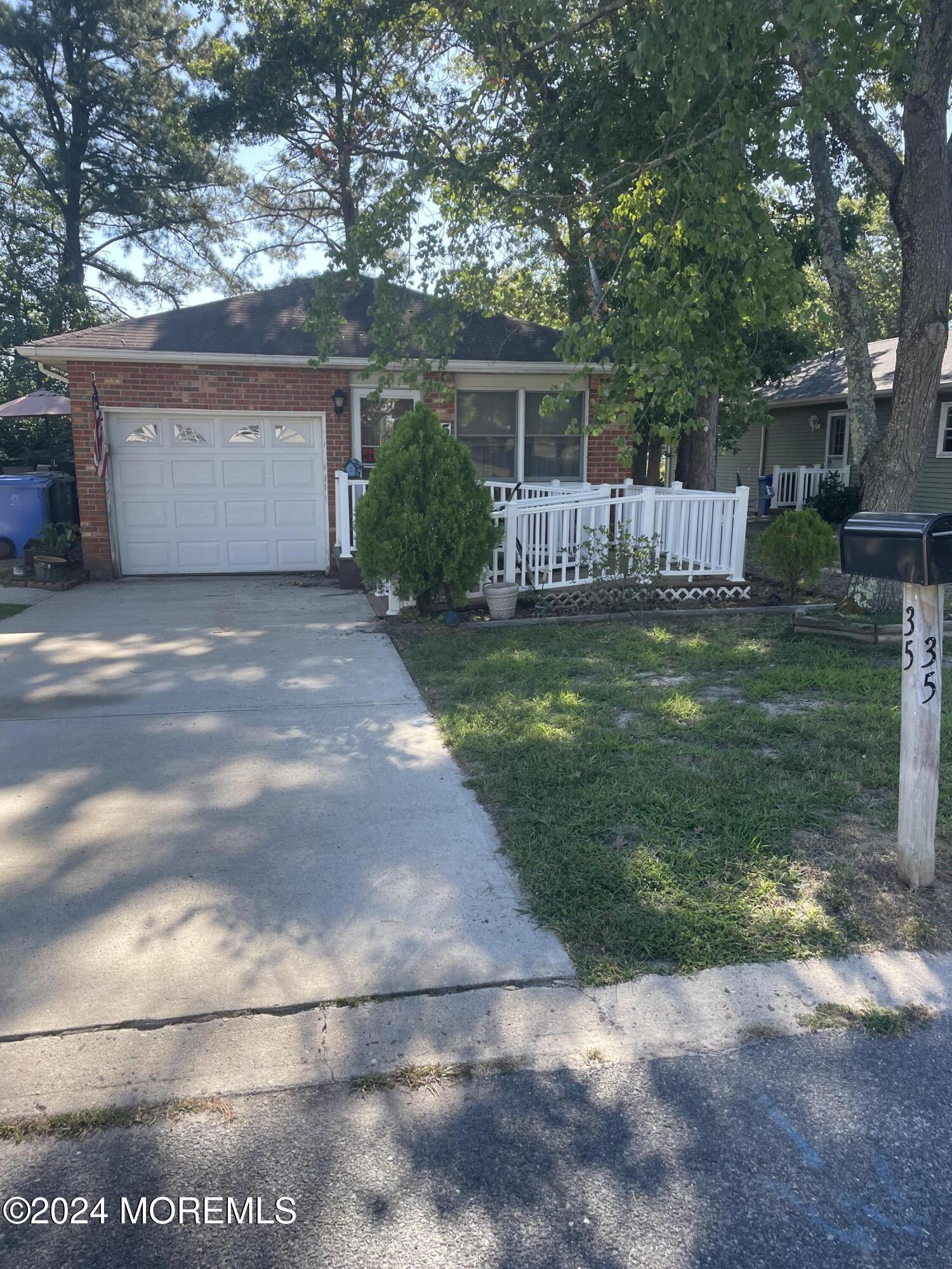 35 Sycamore Access Road, Unit 12 Manahawkin, NJ 08050 - Photo 3 of 34 a view of a house with backyard and a garden