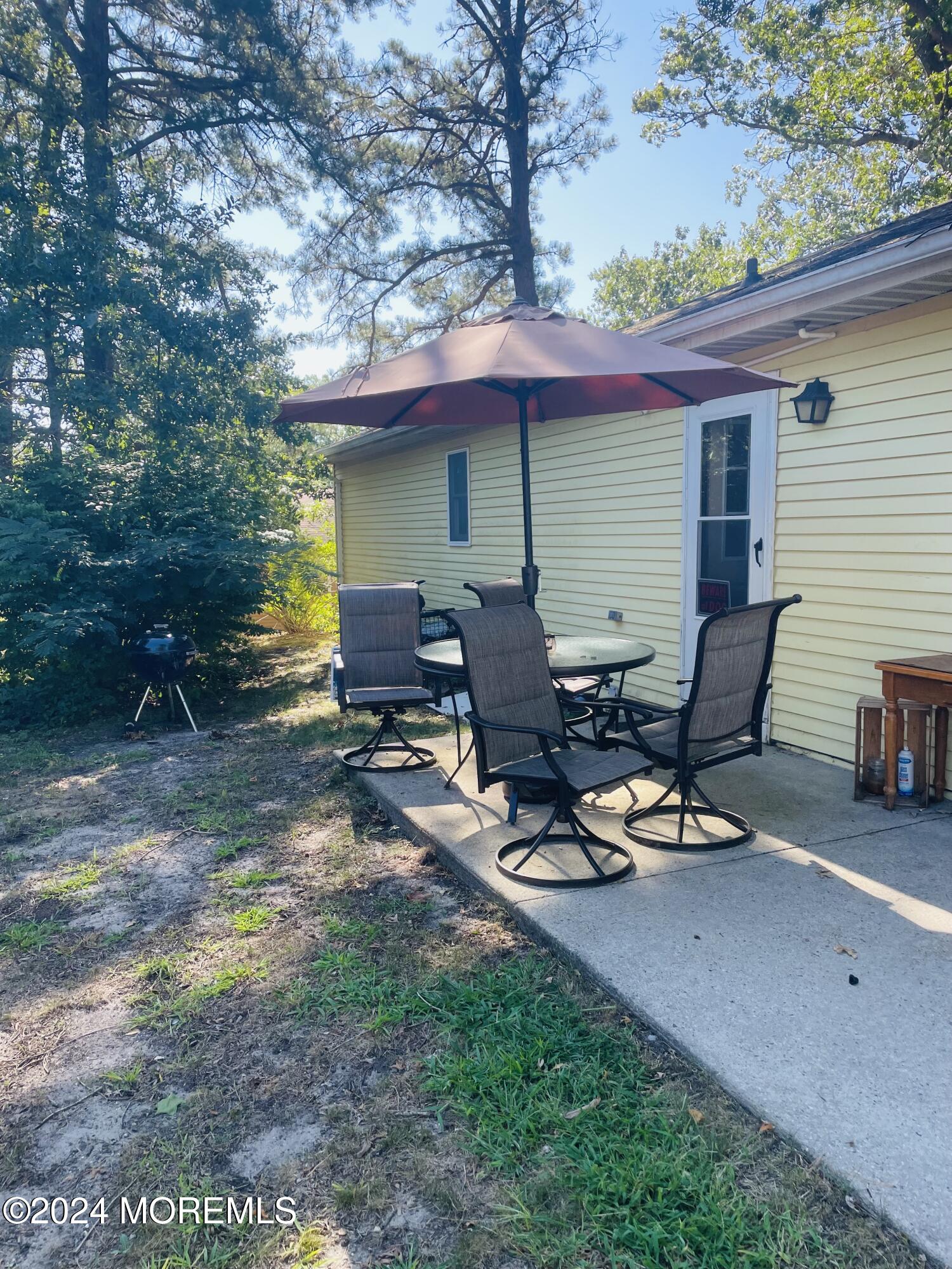 35 Sycamore Access Road, Unit 12 Manahawkin, NJ 08050 - Photo 4 of 34 a view of a lounge chairs in the back yard