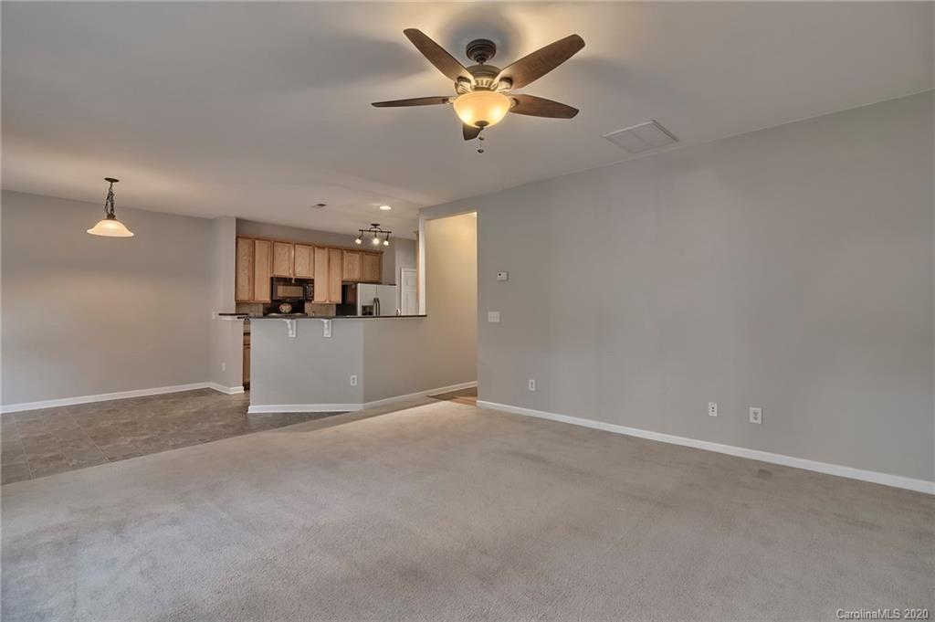 190 Snead Road, Unit 177 Fort Mill, SC 29715 - Photo 21 of 42 an empty room with a empty space and a ceiling fan
