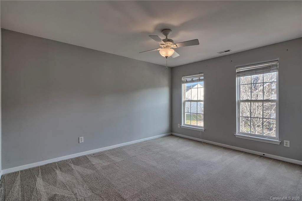 190 Snead Road, Unit 177 Fort Mill, SC 29715 - Photo 24 of 42 an empty room with windows and fan