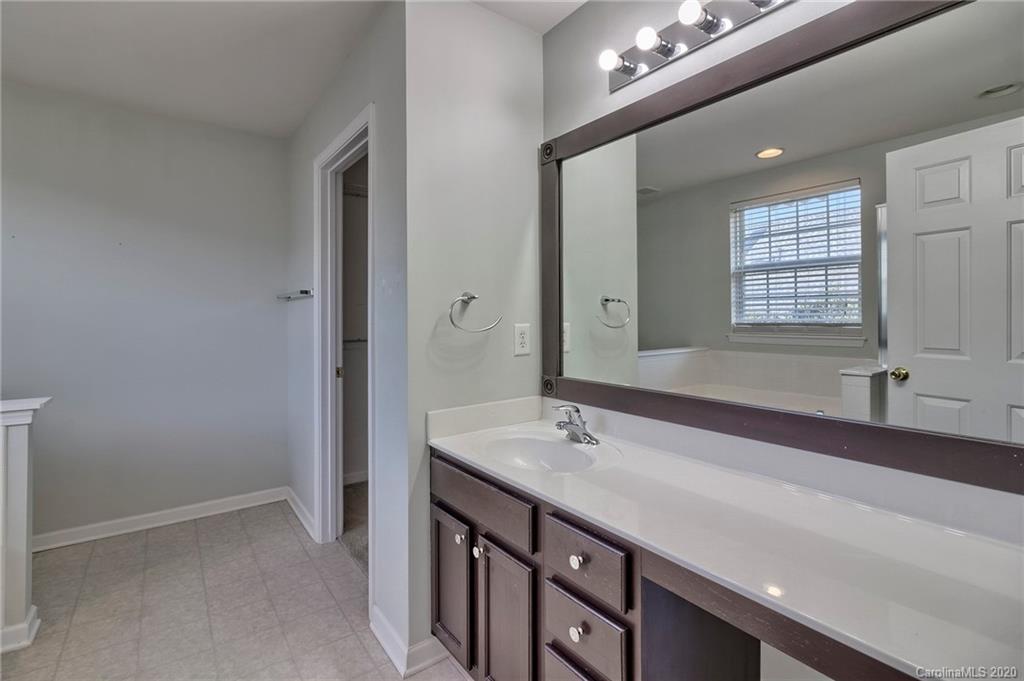 190 Snead Road, Unit 177 Fort Mill, SC 29715 - Photo 32 of 42 a bathroom with a sink double vanity and a mirror