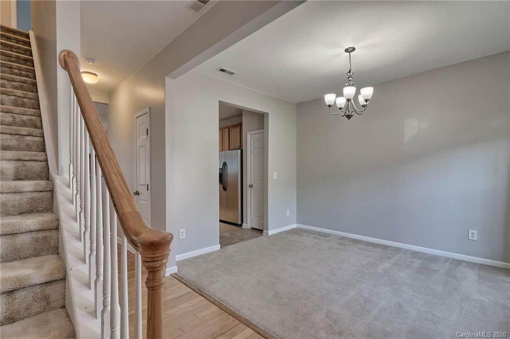 190 Snead Road, Unit 177 Fort Mill, SC 29715 - Photo 7 of 42 wooden floor in an empty room with a mirror