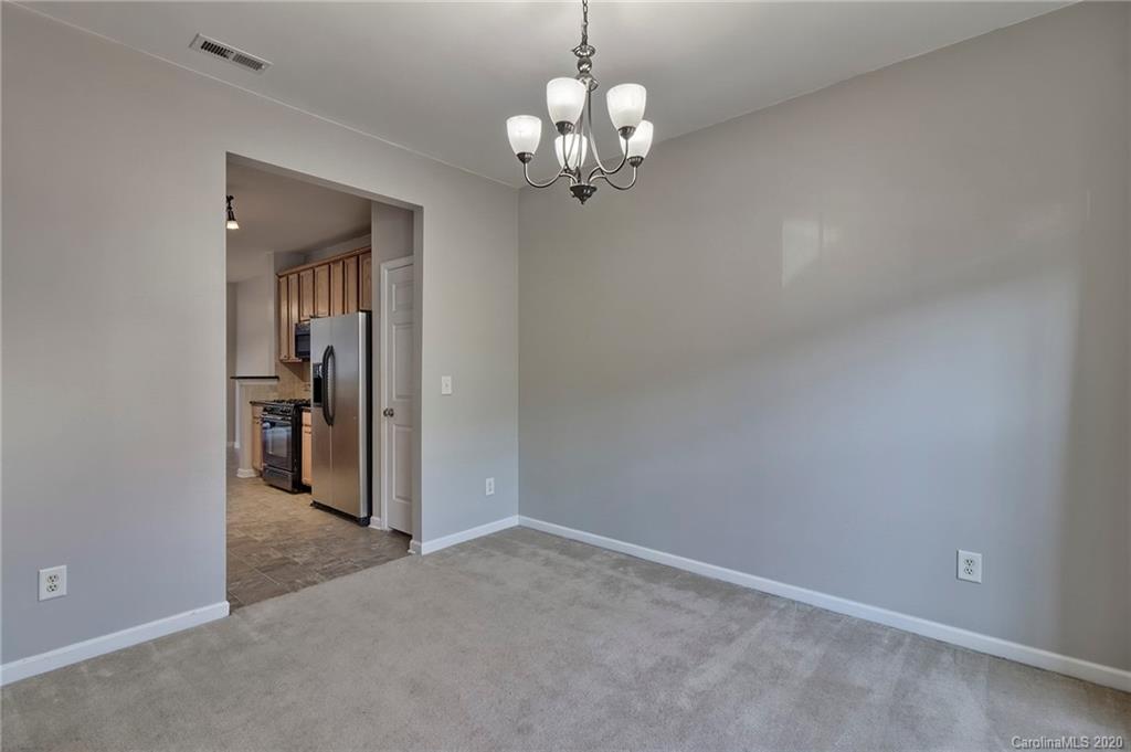 190 Snead Road, Unit 177 Fort Mill, SC 29715 - Photo 10 of 42 a view of a chandelier in an empty room with a chandelier