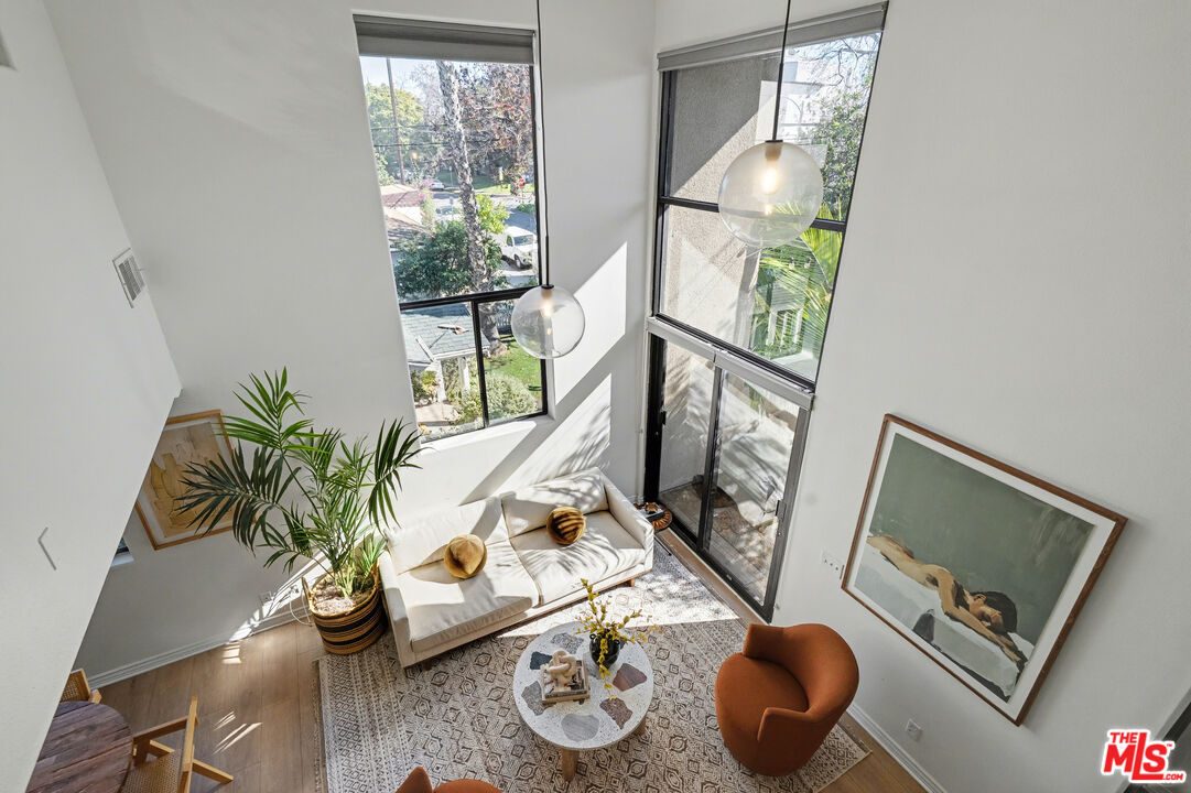 9917 Tabor Street, Unit 2 Los Angeles, CA 90034 - Photo 18 of 38 a living room with furniture and a window