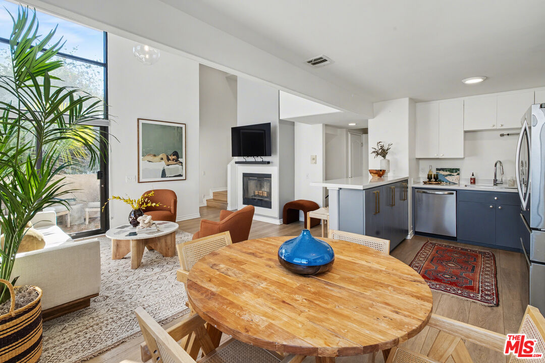 9917 Tabor Street, Unit 2 Los Angeles, CA 90034 - Photo 2 of 38 a view of a dining room with furniture