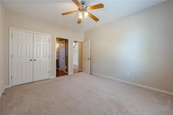 a kitchen with stainless steel appliances granite countertop a refrigerator a sink dishwasher and a stove with wooden floor