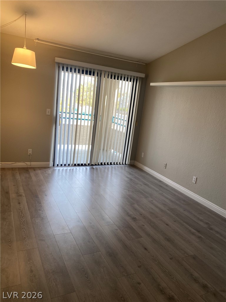 5271 South Lindell Road, Unit 202 Las Vegas, NV 89118 - Photo 7 of 27 Sliding doors open to a private balcony, offering seamless indoor-outdoor living.
