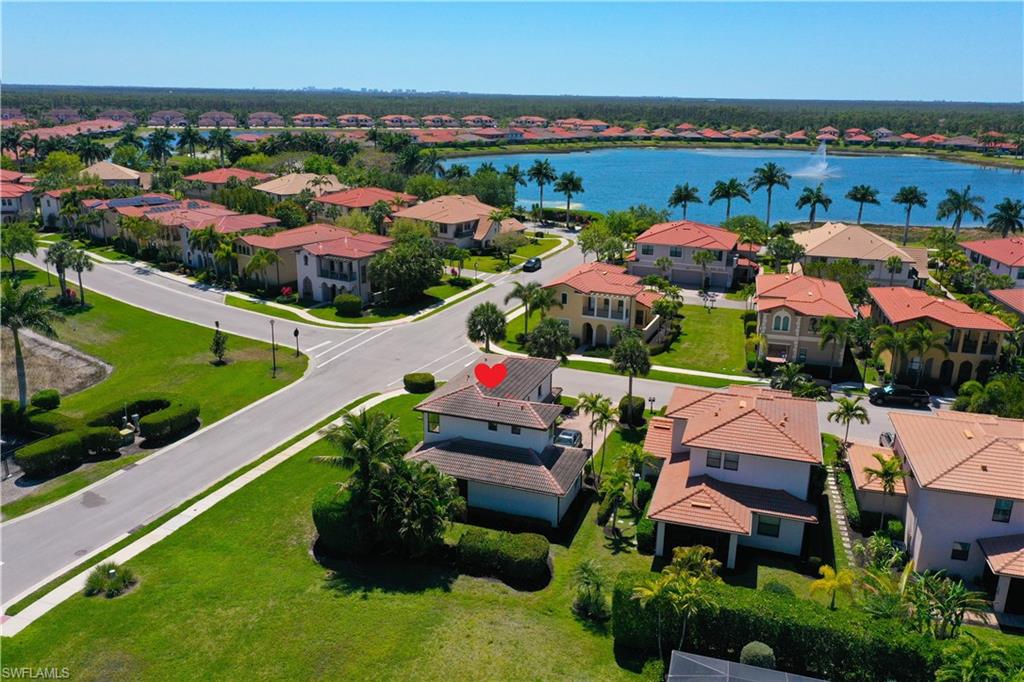 1307 Kendari Terrace Naples, FL 34113 - Photo 1 of 45 Aerial perspective of suburban area featuring a nearby body of water