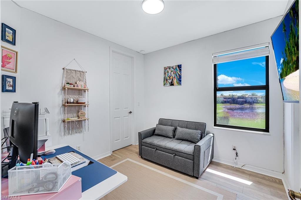 1307 Kendari Terrace Naples, FL 34113 - Photo 24 of 45 Office with light wood-style flooring and baseboards