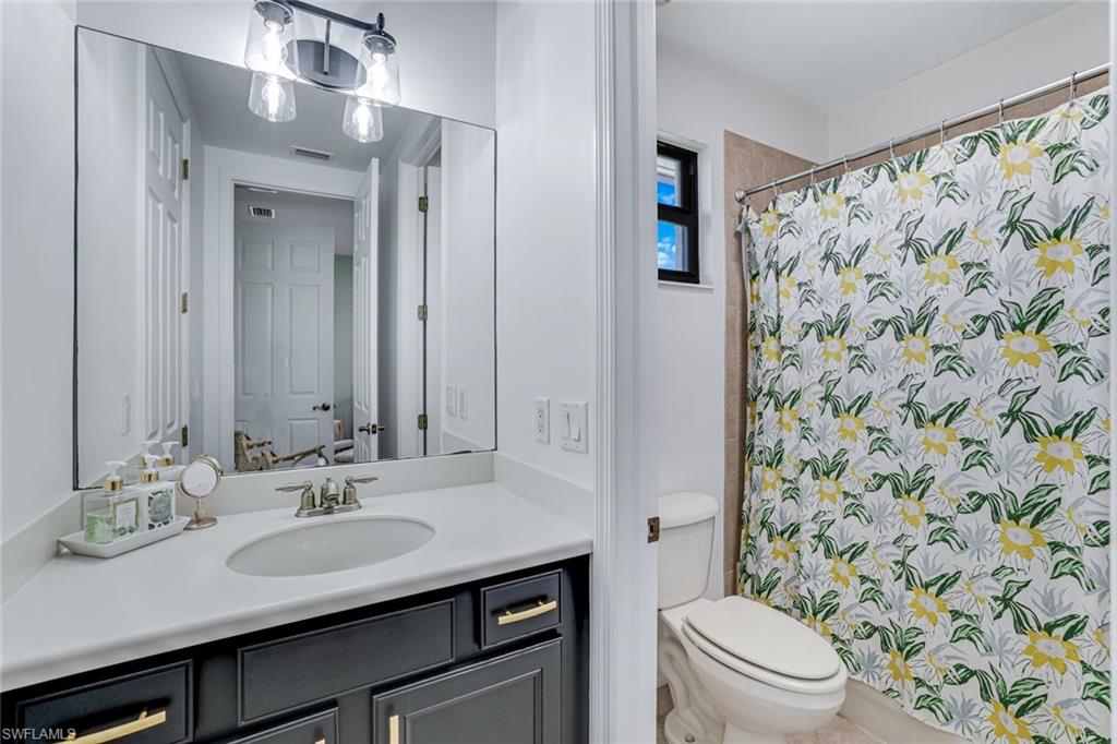 1307 Kendari Terrace Naples, FL 34113 - Photo 25 of 45 Full bath with vanity and a shower with shower curtain