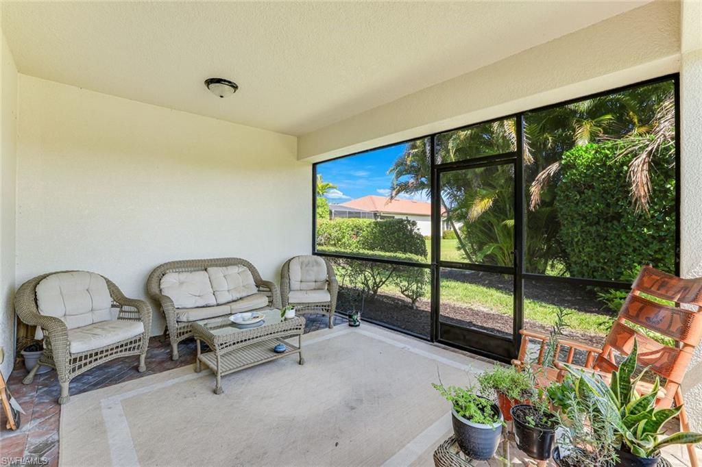 1307 Kendari Terrace Naples, FL 34113 - Photo 30 of 45 Sunroom featuring an outdoor hangout area