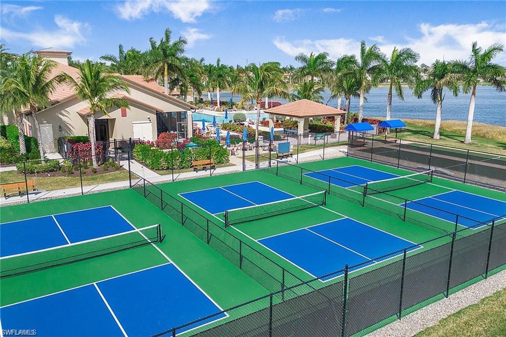 1307 Kendari Terrace Naples, FL 34113 - Photo 36 of 45 View of tennis court featuring a gazebo