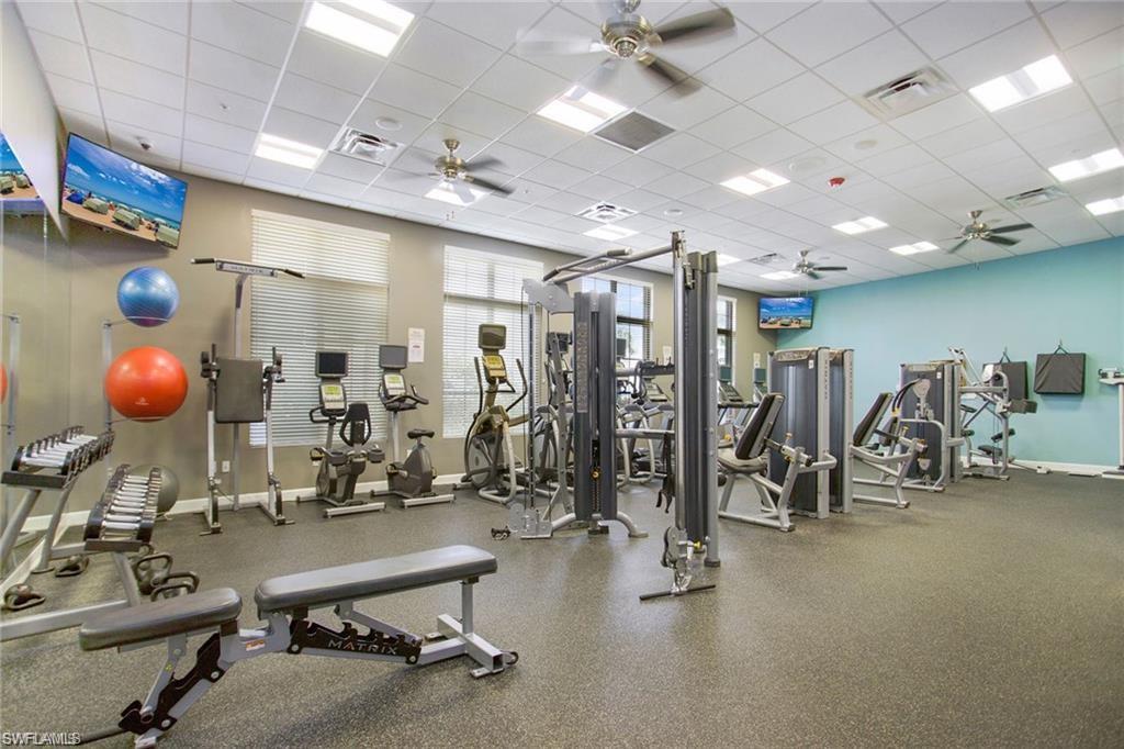 1307 Kendari Terrace Naples, FL 34113 - Photo 40 of 45 Gym with a drop ceiling and a ceiling fan