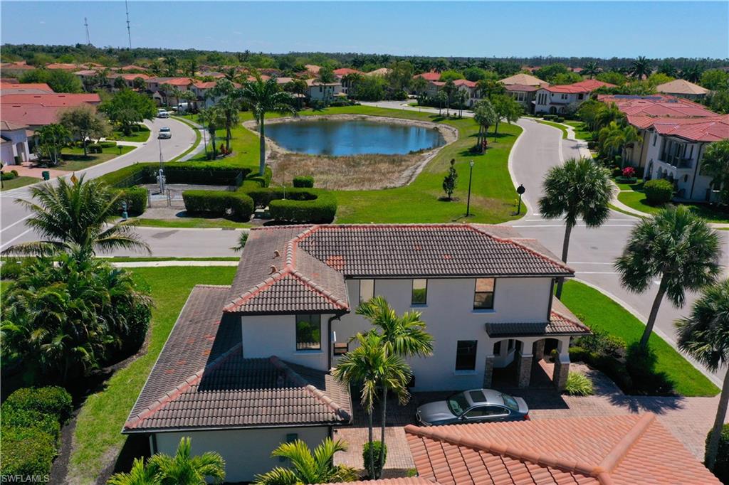1307 Kendari Terrace Naples, FL 34113 - Photo 7 of 45 Aerial view of residential area featuring a large body of water