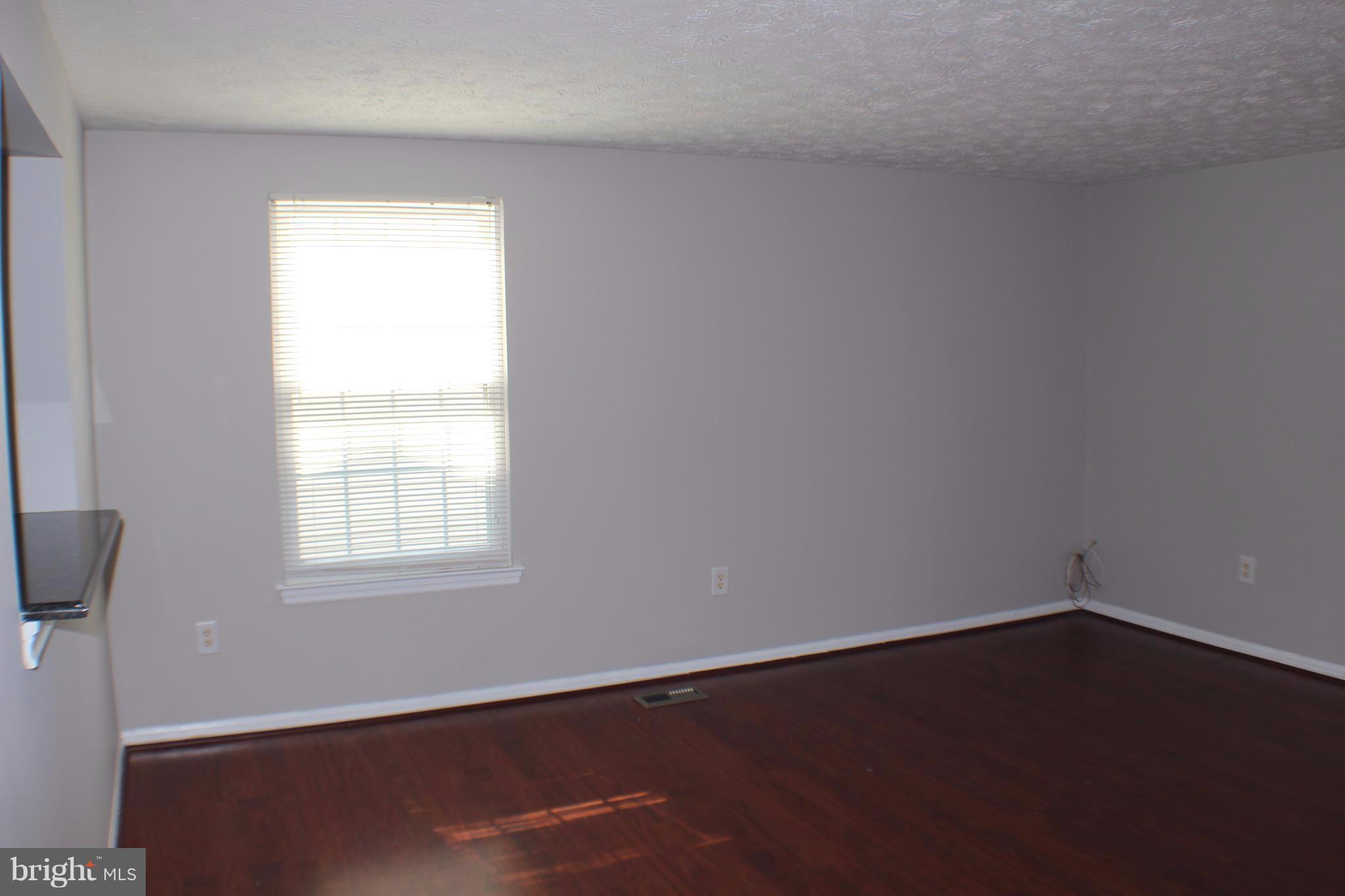 6308 Greenfield Road Elkridge, MD 21075 - Photo 5 of 14 an empty room with a window
