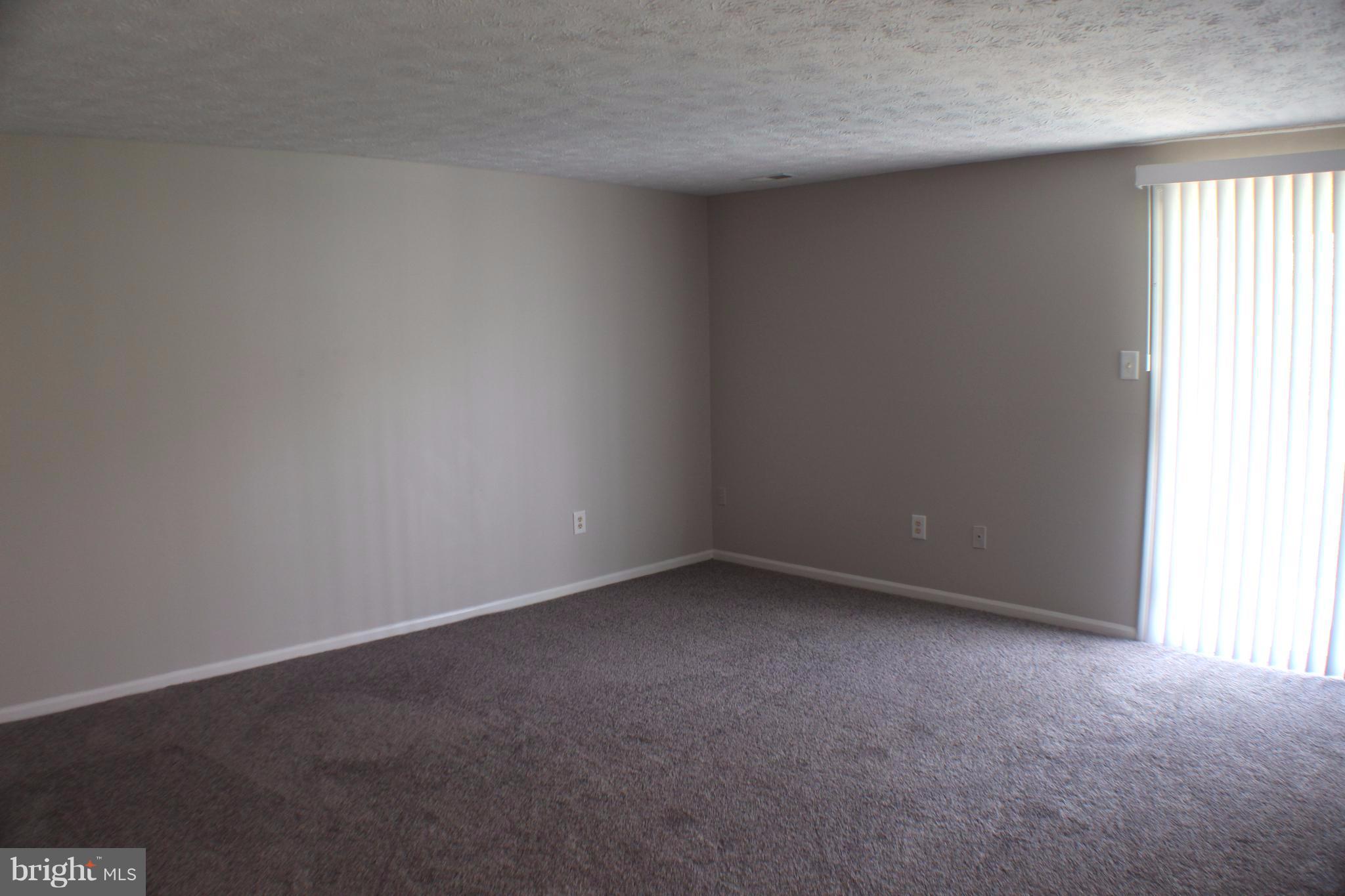 6308 Greenfield Road Elkridge, MD 21075 - Photo 8 of 14 a view of an empty room and a window