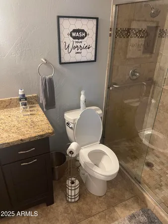 a toilet sitting next to a bathroom sink
